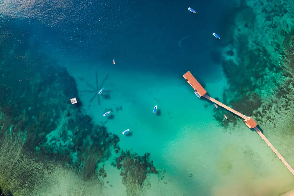 a dock and boats in the water at Tioman-island in Pahang