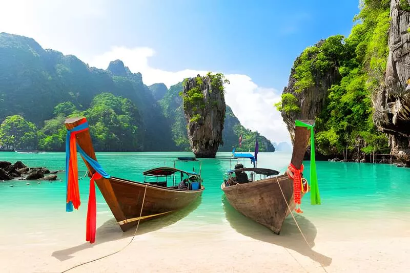 Phuket Travel Tips: A Complete Guide for First-Time Visitors 8 Tropical boats by serene turquoise waters