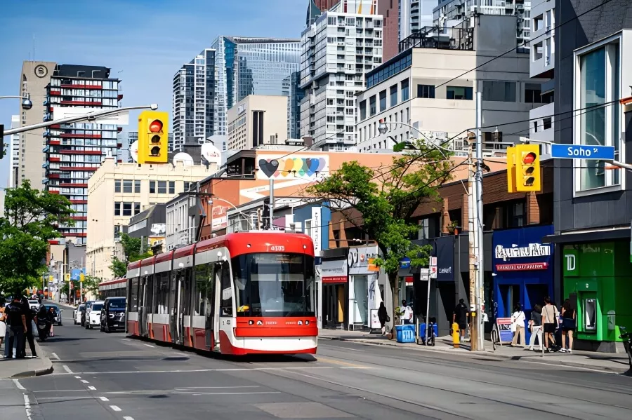 Ultimate 3-Day Toronto Itinerary: A Detailed Travel Guide 10 Tram on busy urban street.